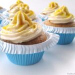 vegan vanilla cupcakes with frosting on white board