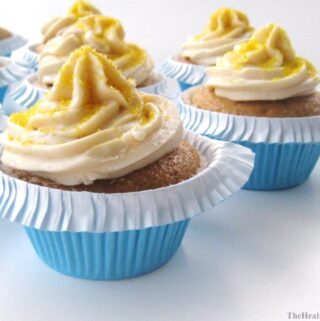 vegan vanilla cupcakes with frosting on white board