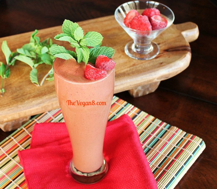 Mint chocolate strawberry shake in a tall glass