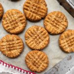 several peanut butter cookies on cookie sheet