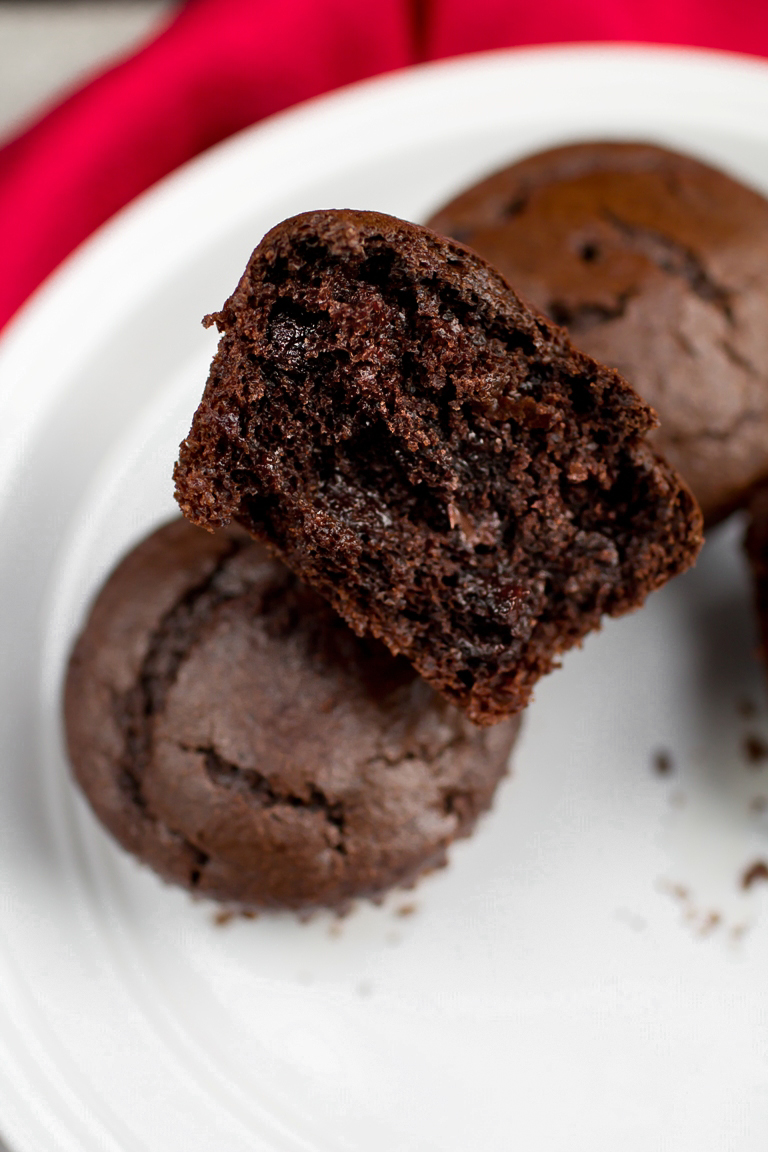 Closeup view of double chocolate muffins on white plate