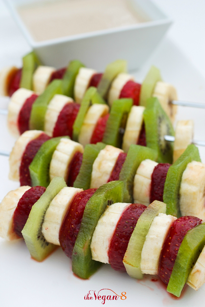 fruit kabobs on white platter