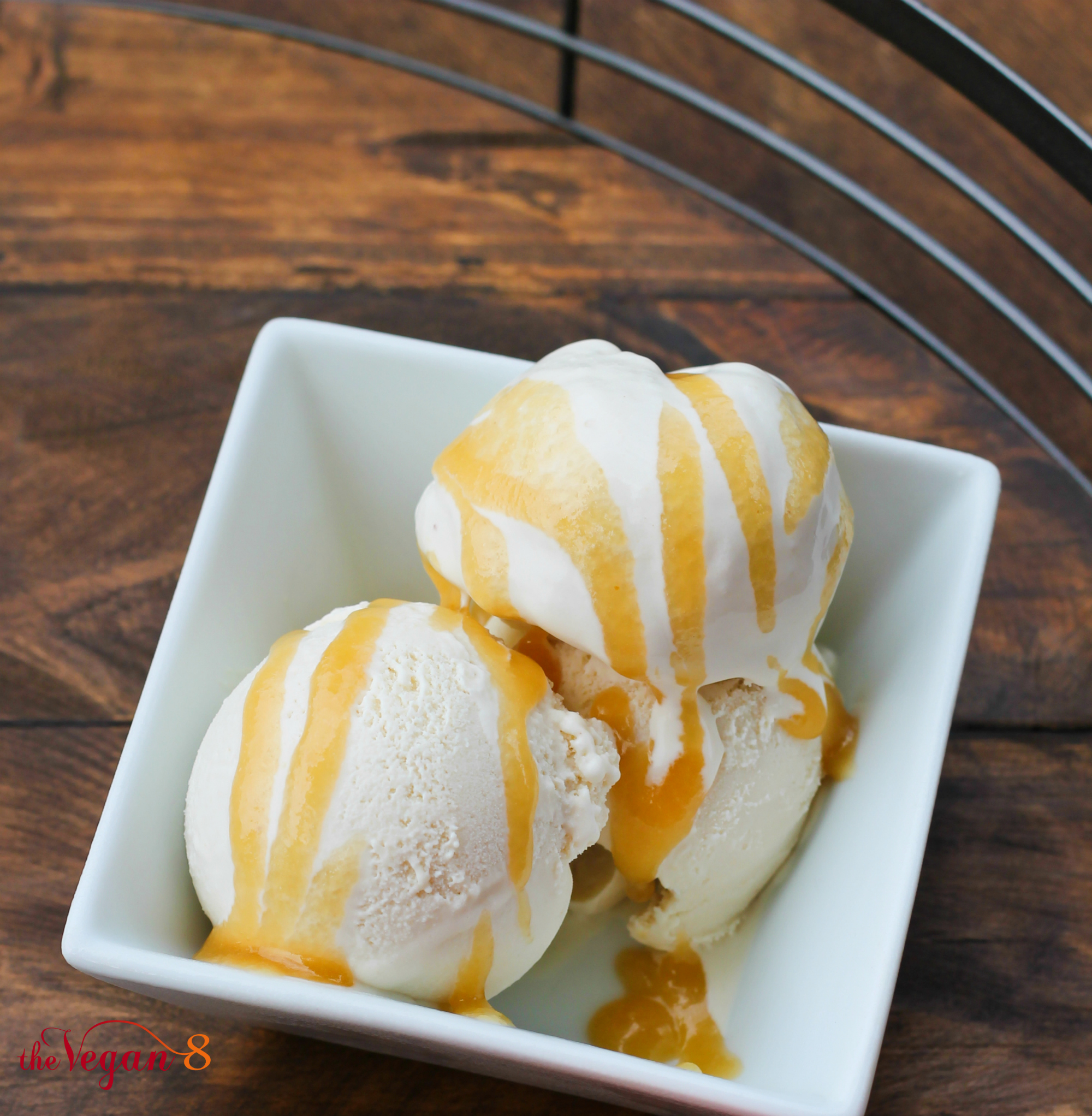 vegan vanilla cheesecake ice cream with caramel in white bowl