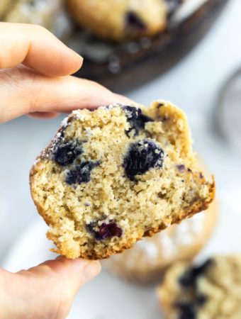 hand holding closeup of muffin showing inside texture