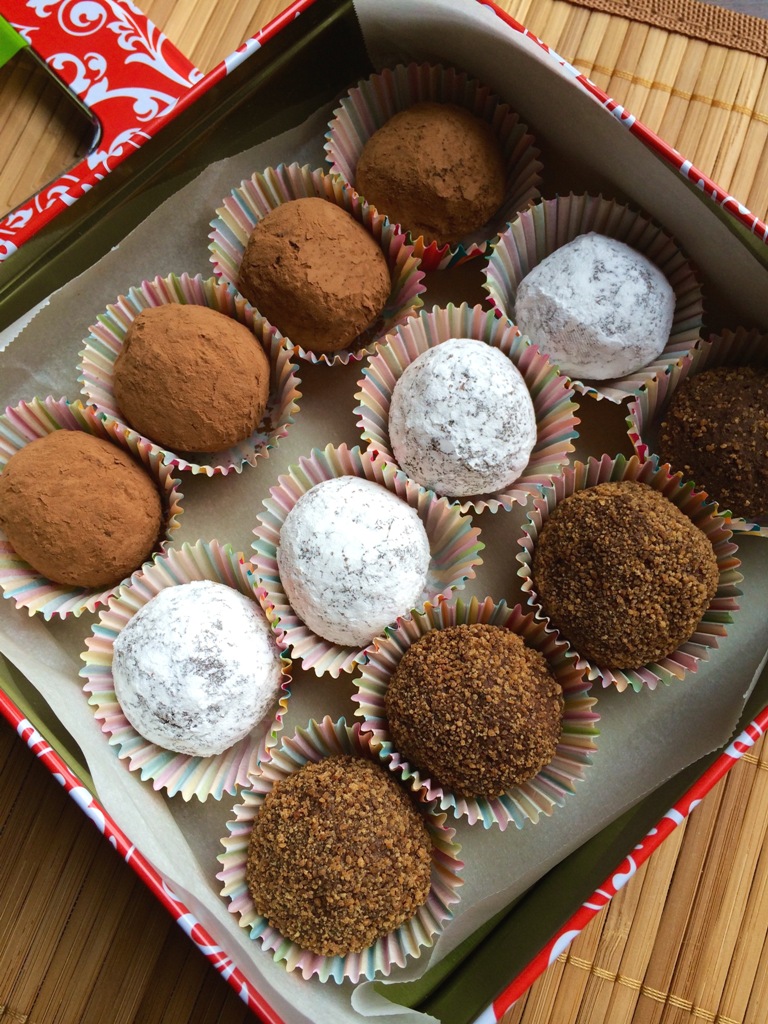 container of vegan chocolate truffles with different coatings