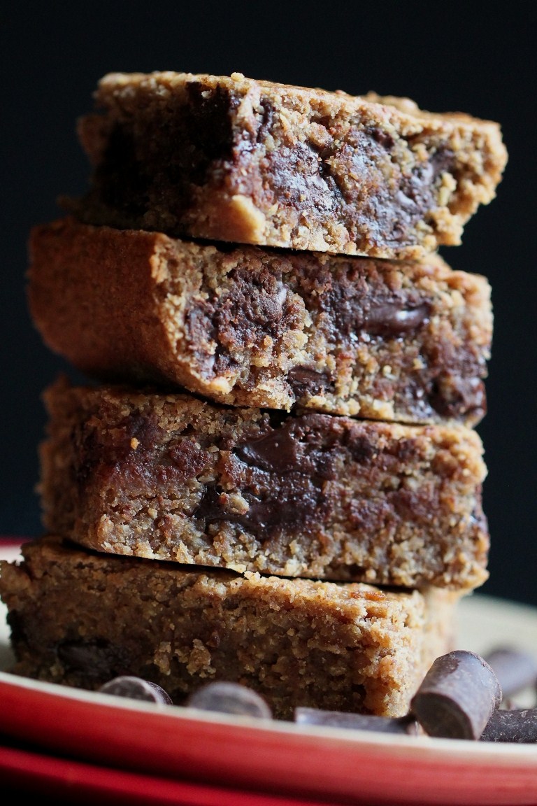 Closeup view of stacked almond butter chocolate chunk blondies