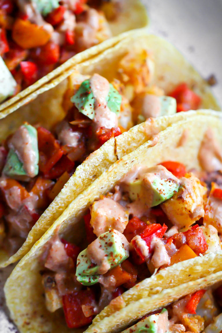 closeup of vegan Mexican potato tacos on platter