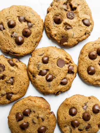 baked vegan gluten-free chocolate chip cookies on white marble