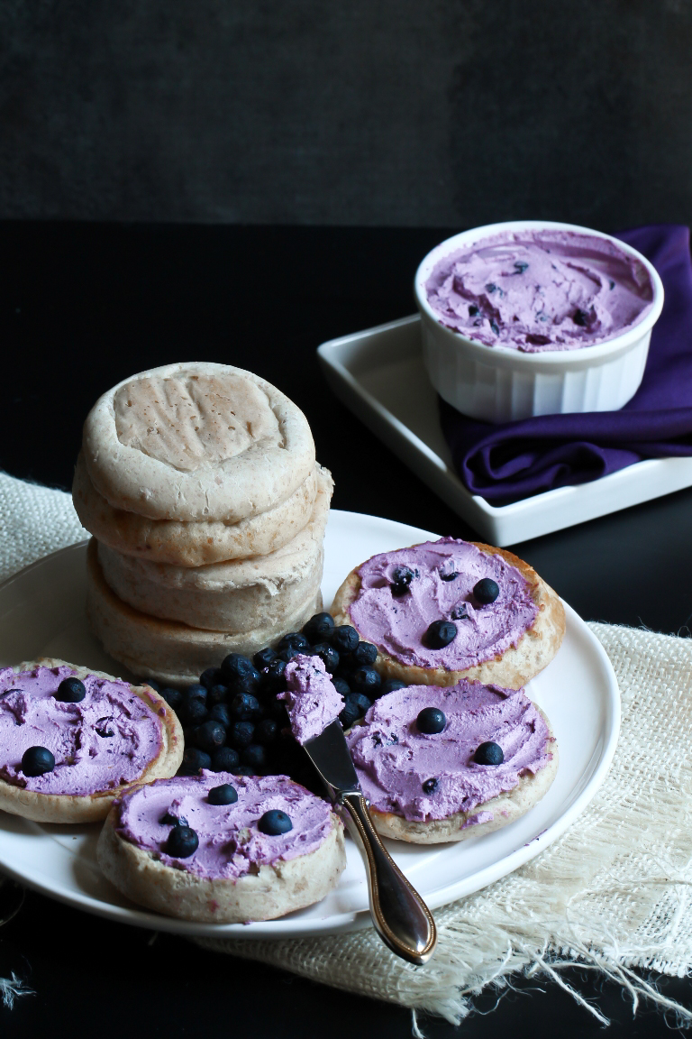 Plate with bagels of vegan blueberry cream cheese on top.