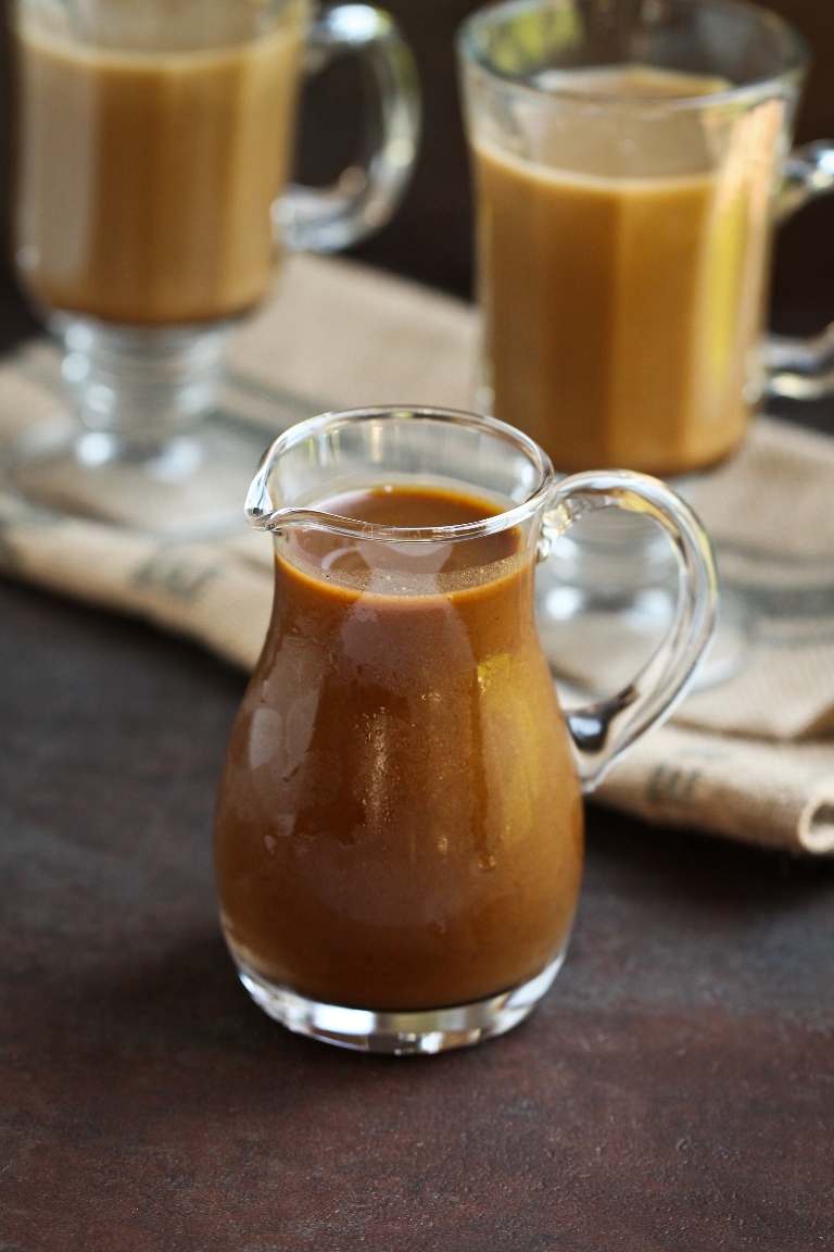 vegan pumpkin spice sauce in glass pitcher