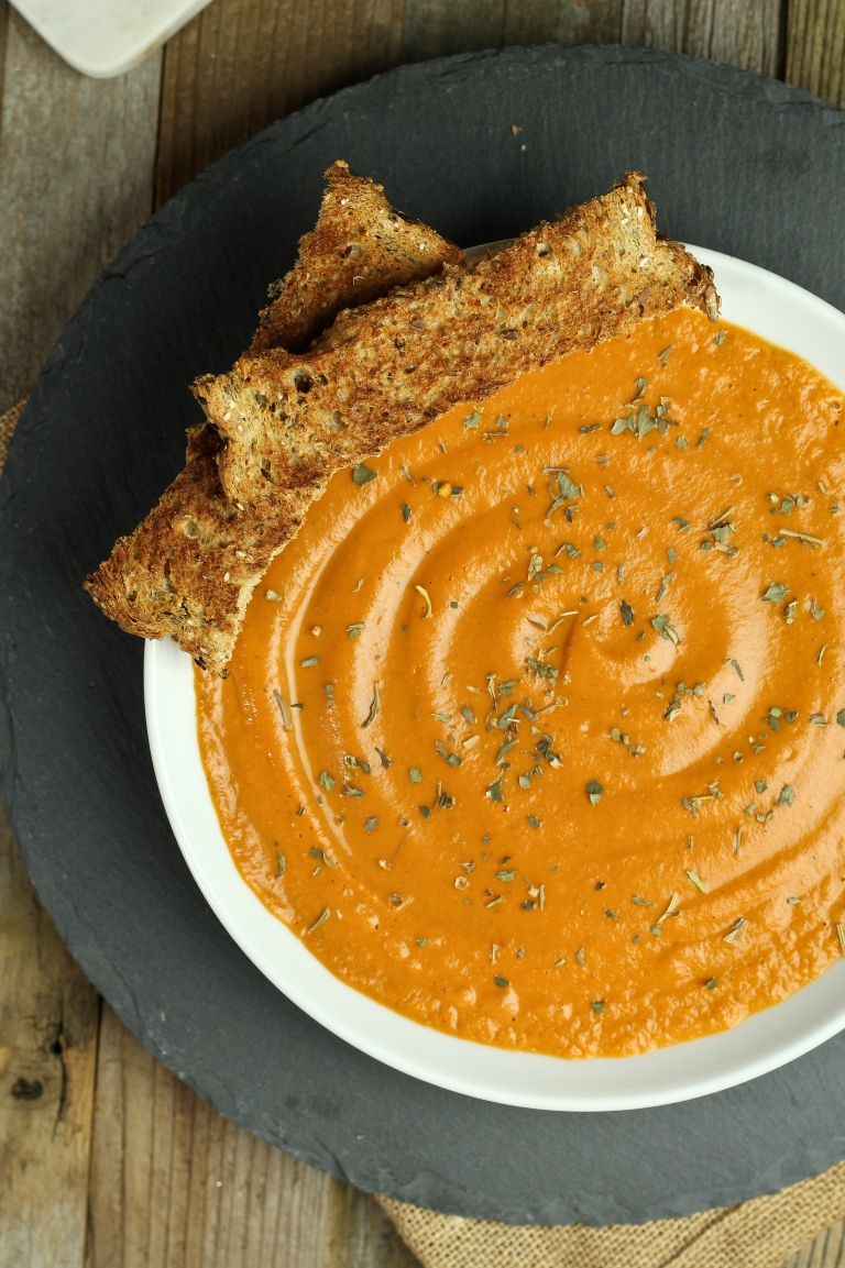 Vegan tomato bisque in white bowl