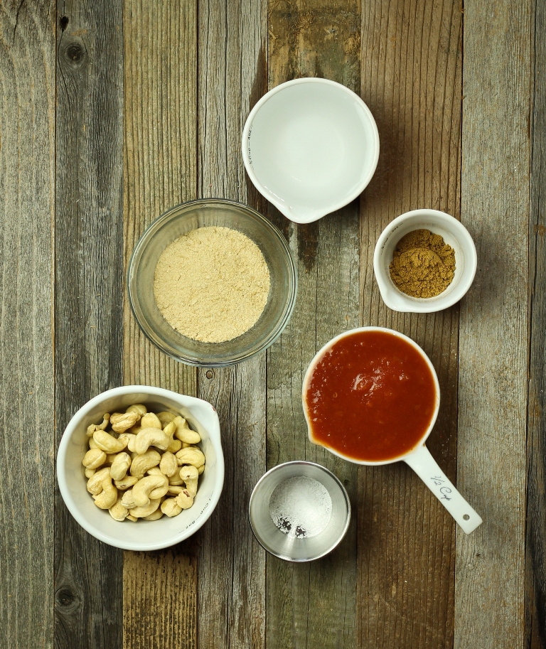 Vegan Mexican cheese sauce ingredients on wood table