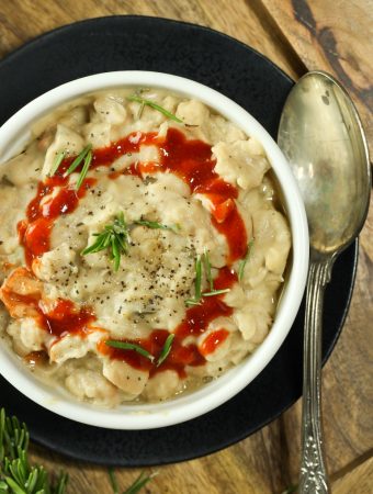 rosemary white beans in white bowl