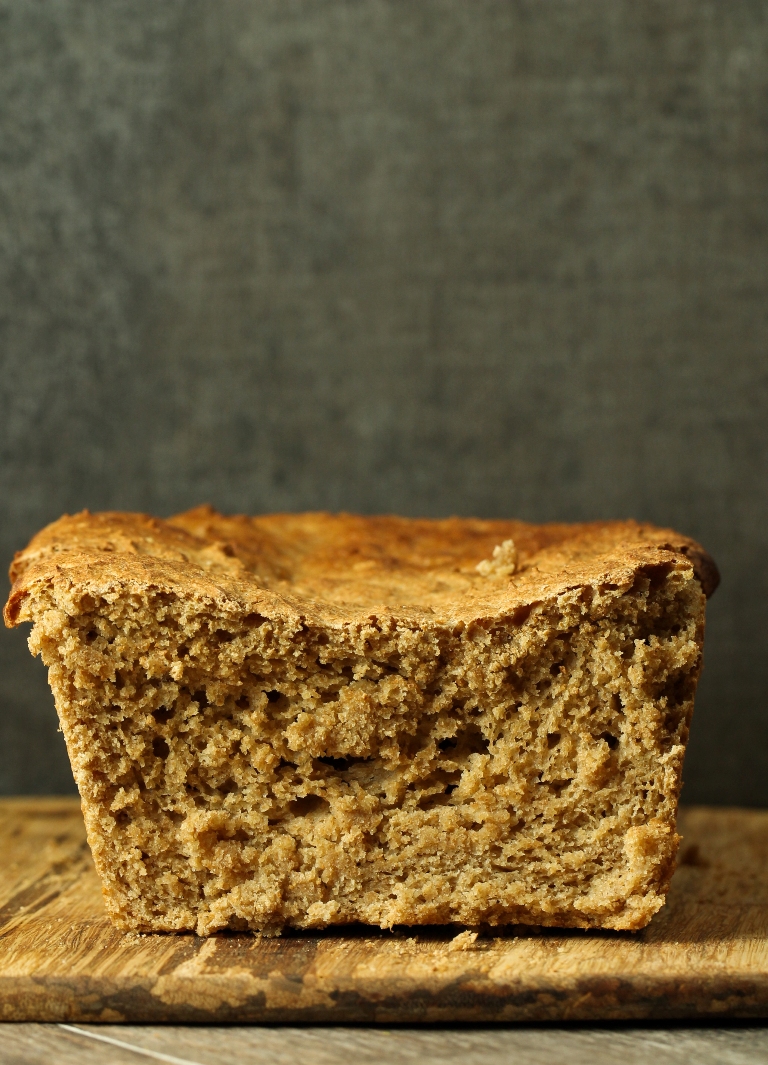 Sunken spelt loaf on wood platter