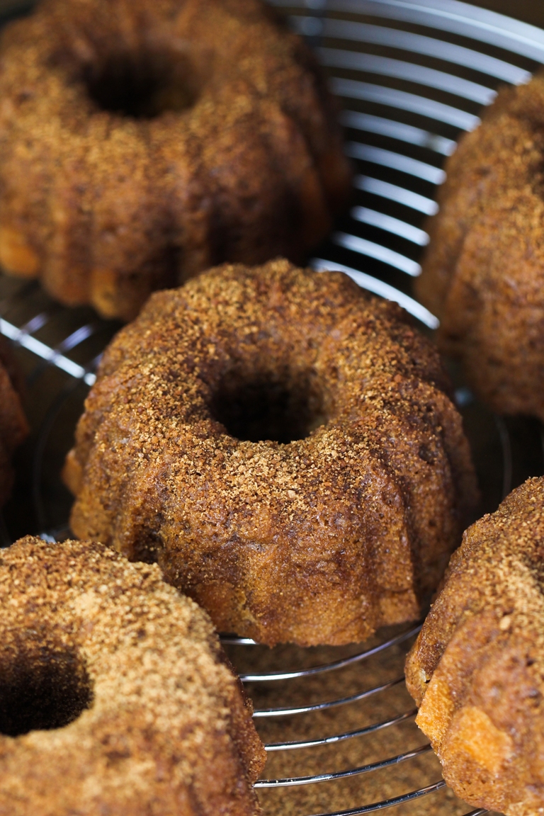 cinnamon cream cheese bundt cake on cooling rack