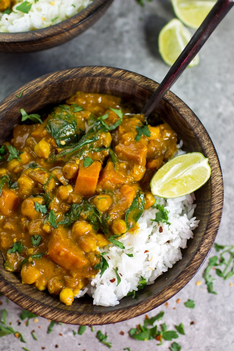 Sweet Potato Chickpea Spinach Coconut Curry in wooden bowl