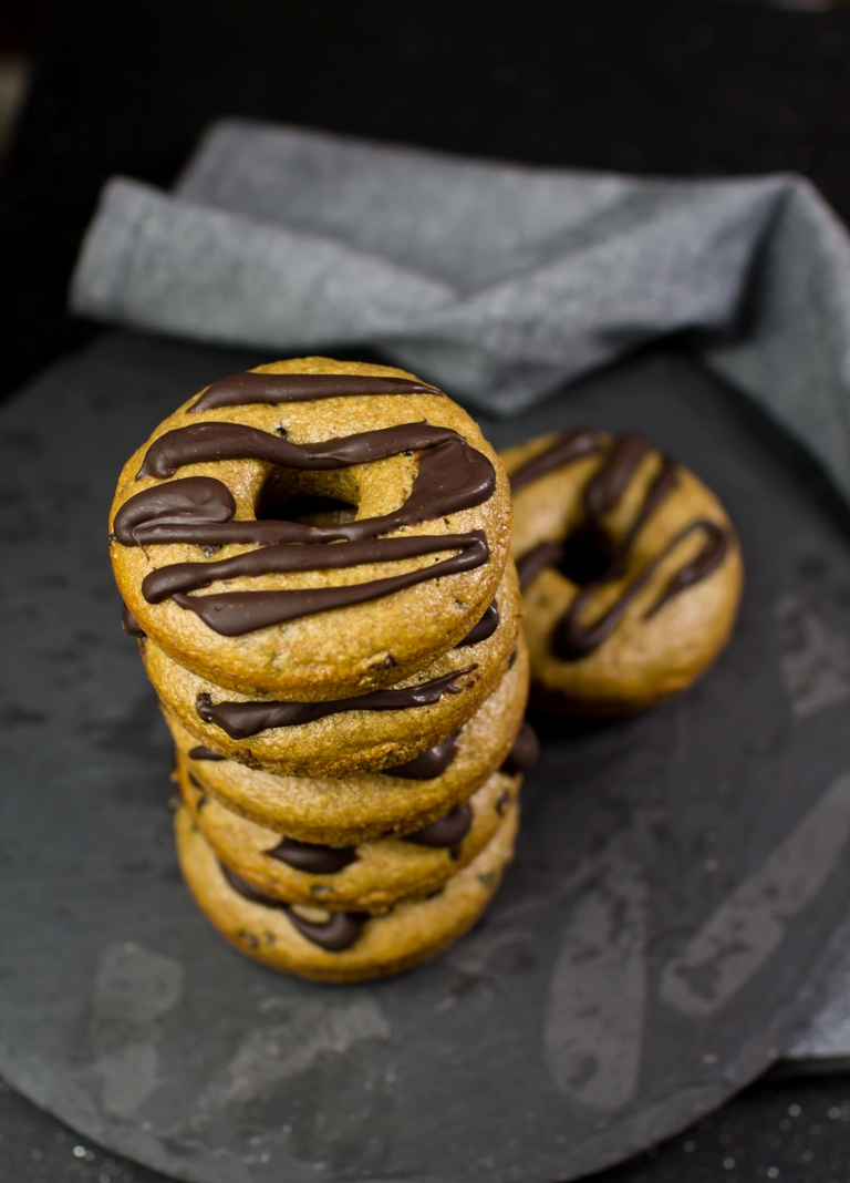 Stack of donuts with chocolate drizzle on top