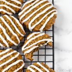 low fat vegan iced oatmeal cookies on cooling rack