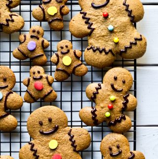 several vegan gingerbread men cookies on cooling rack