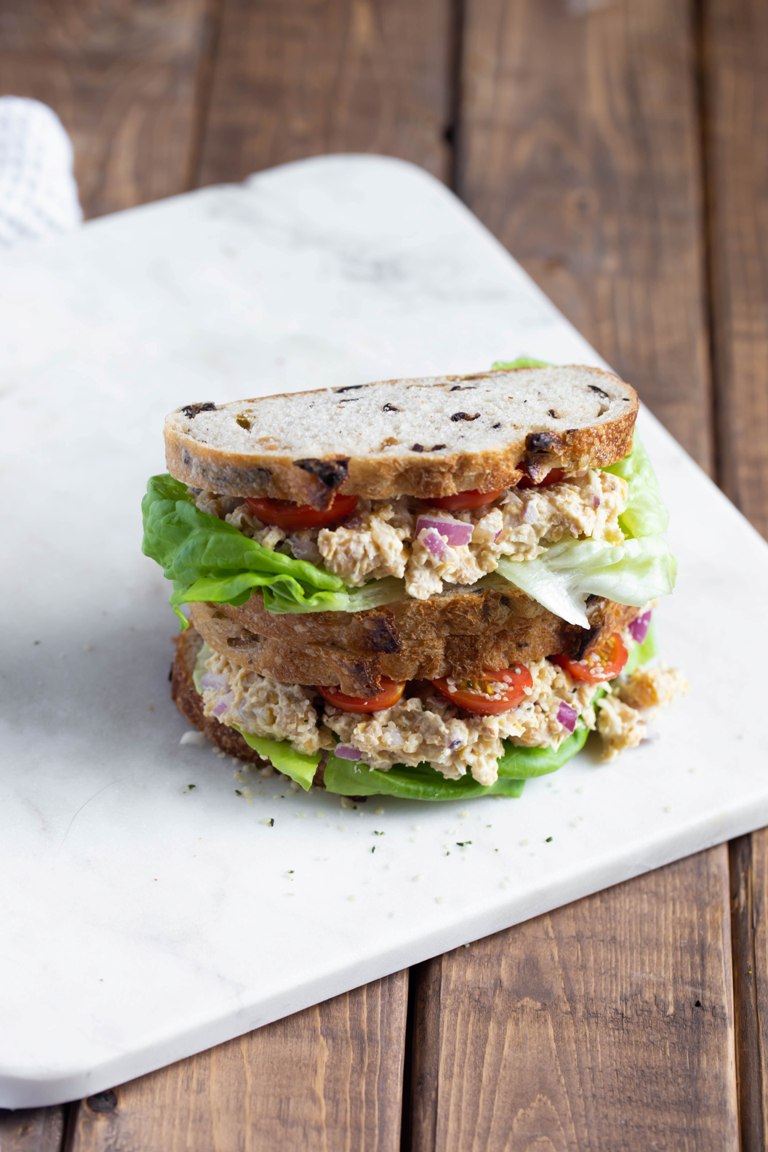 2 vegan Caesar smashed chickpeas sandwiches stacked