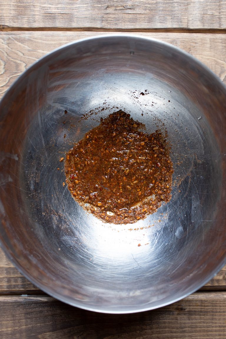 Bowl of Jamaican jerk seasonings and lime juice