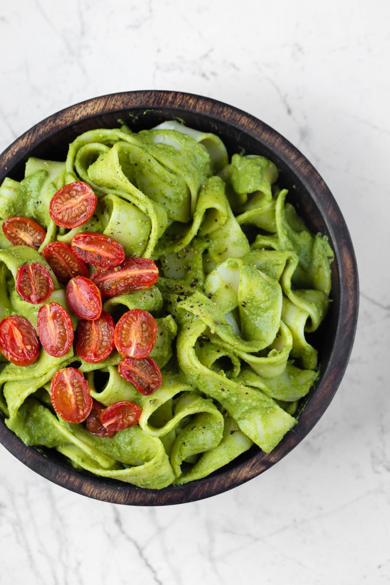 wooden bowl of chimichurri sauce and pappardelle noodles
