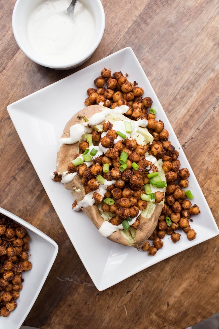 smoky chipotle chickpeas on top of a sweet potato