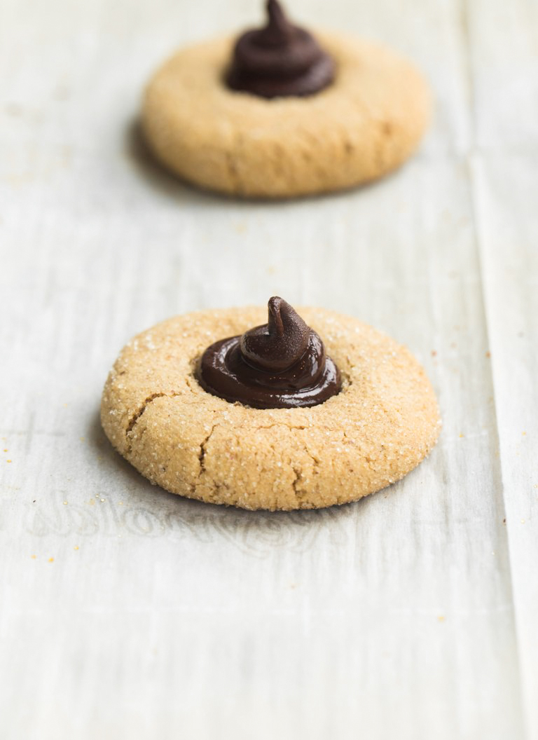 2 vegan almond butter blossoms cookies on a pan