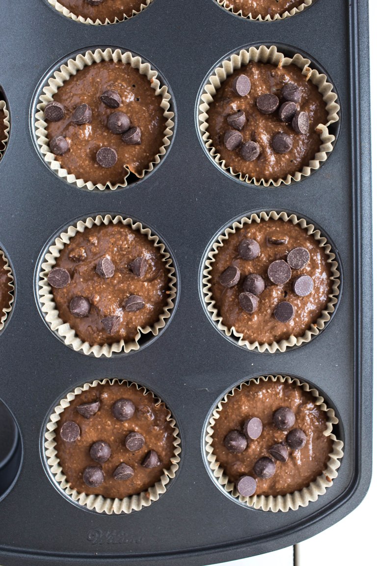 Pre-baked vegan chocolate zucchini muffins in tray