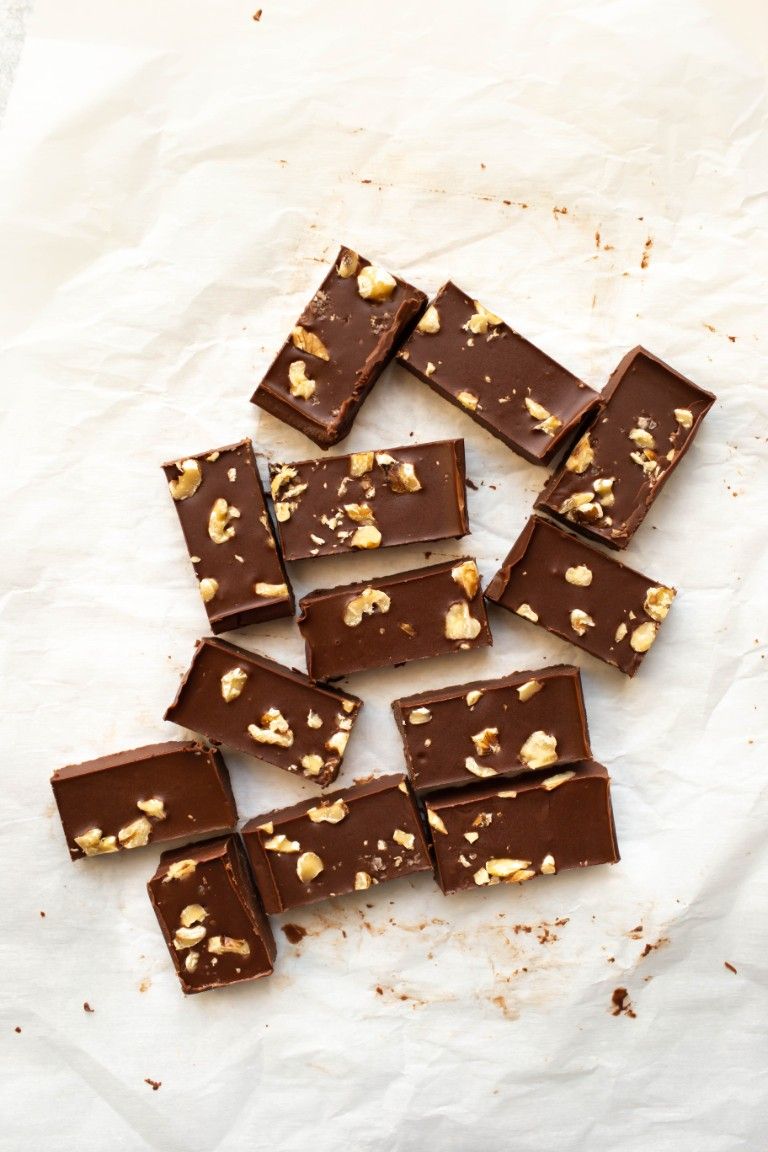 bite size vegan fudge pieces on parchment paper