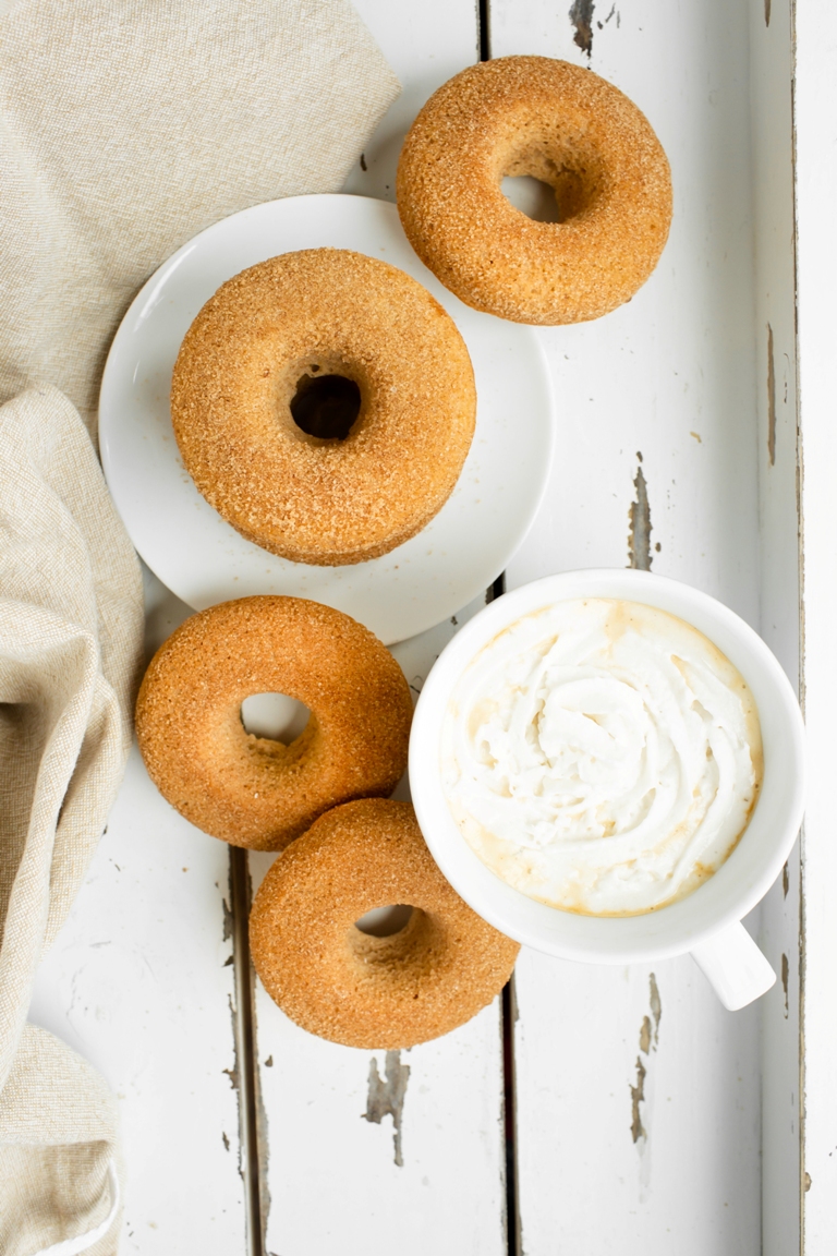 Overhead view of donuts next to cup of hot chocolate