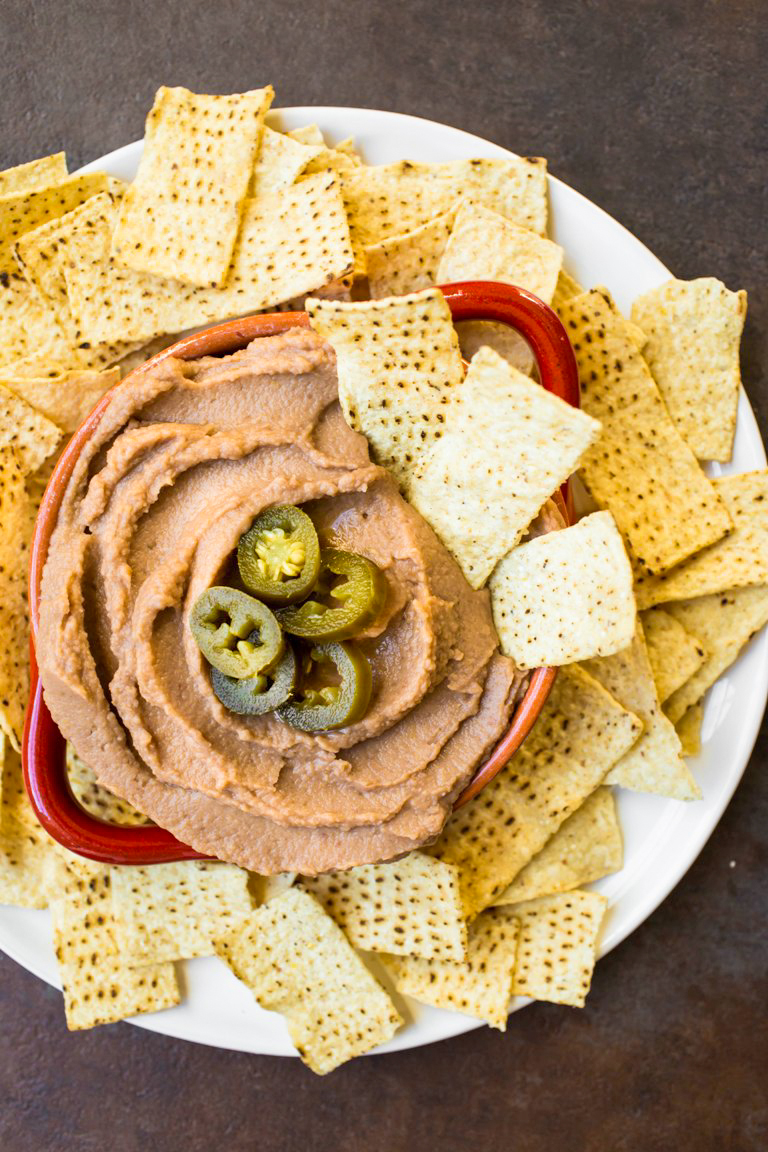 Plate of chips and vegan refried bean dip