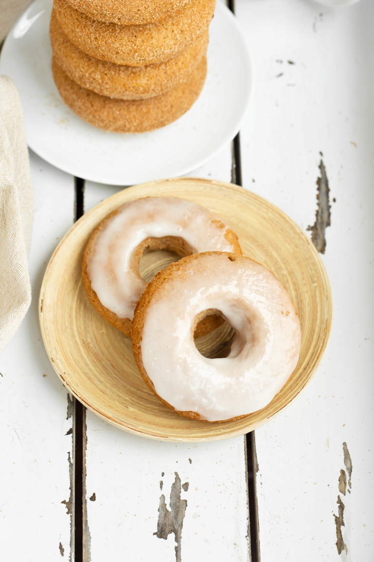 Vegan sugar glazed donuts on round plate