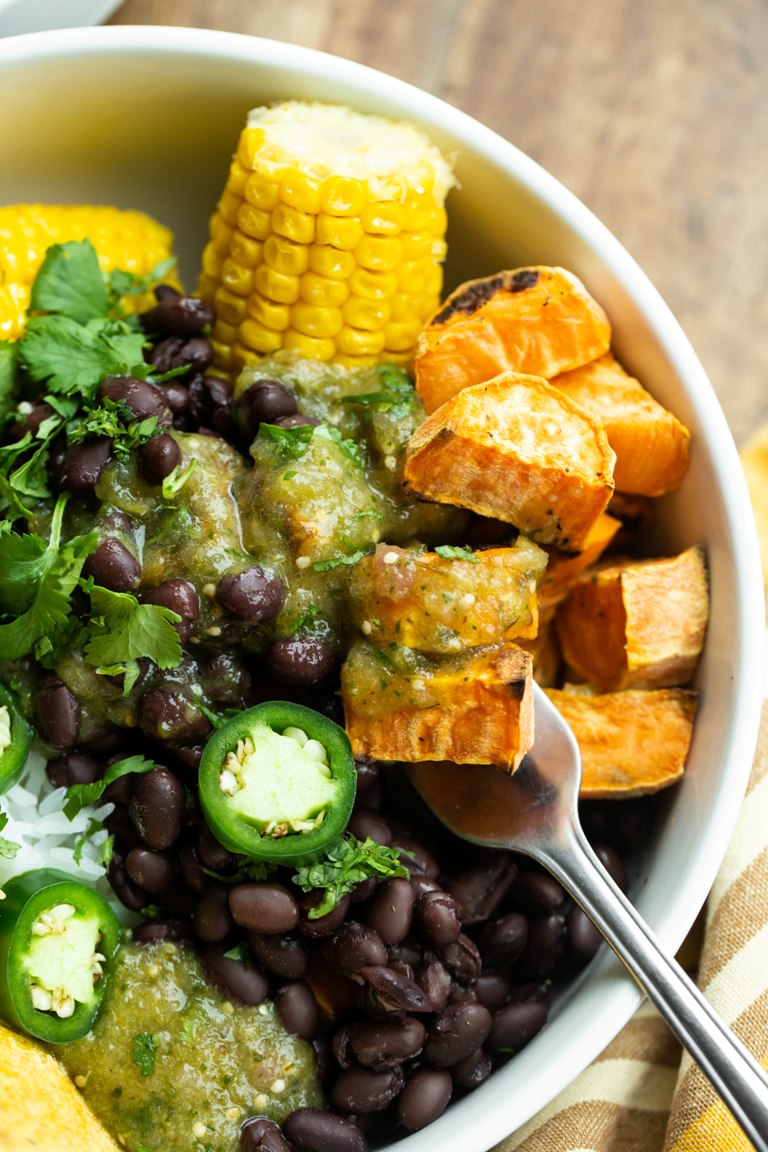 Roasted tomatillo salsa verde bowl with potatoes and corn