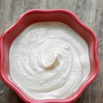 creamy smooth raw cashew butter in red bowl