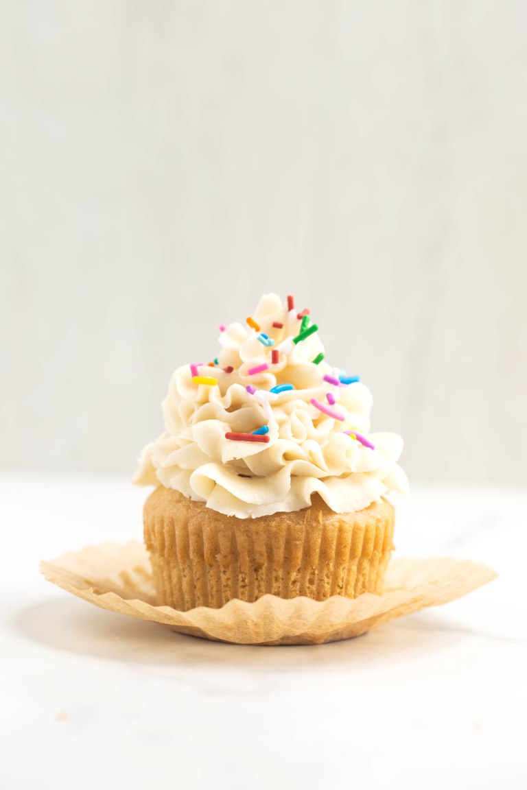 front view of cupcake with vanilla buttercream on top