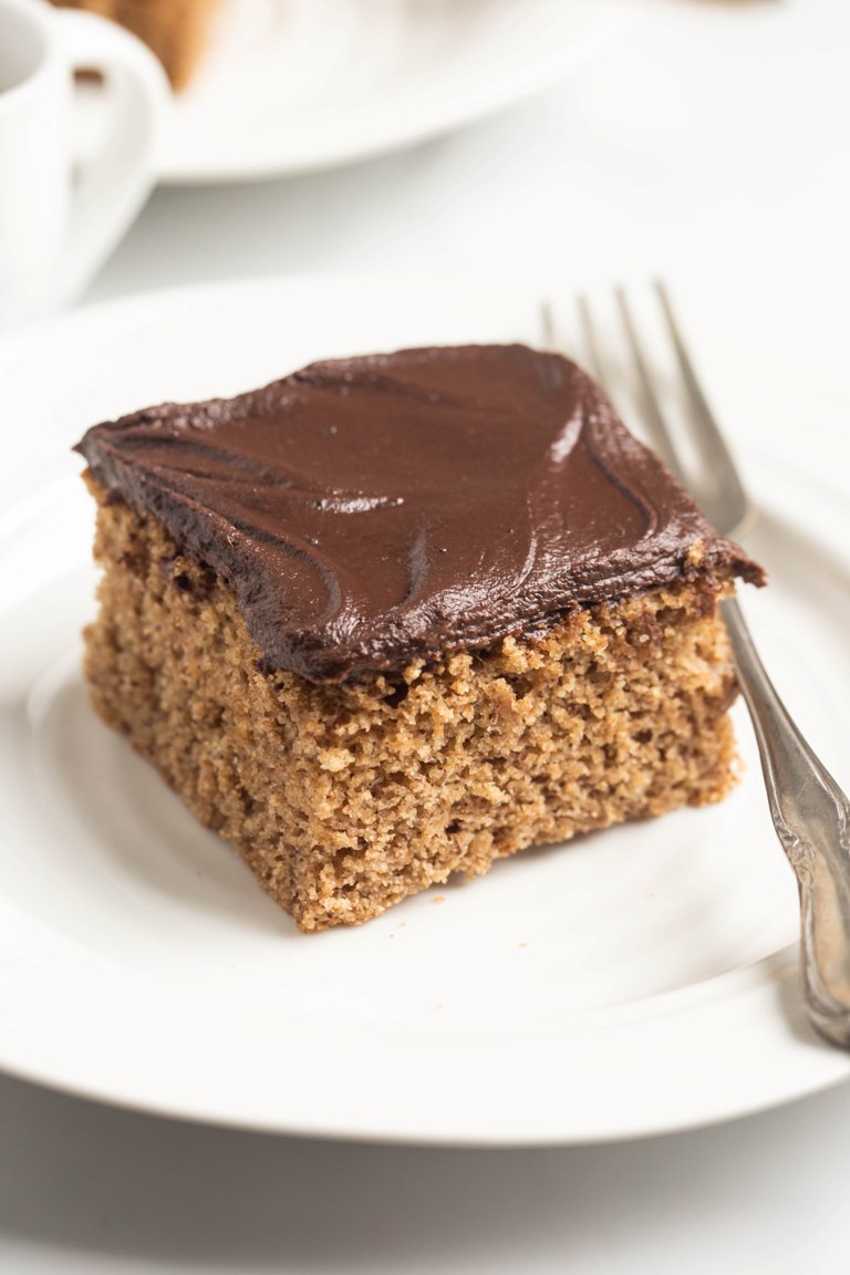 square slice of almond butter cake with fork