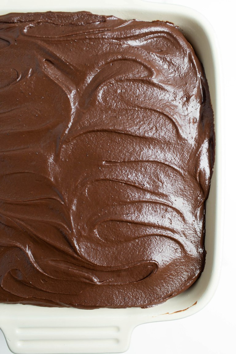 chocolate frosting swirled on top of cake