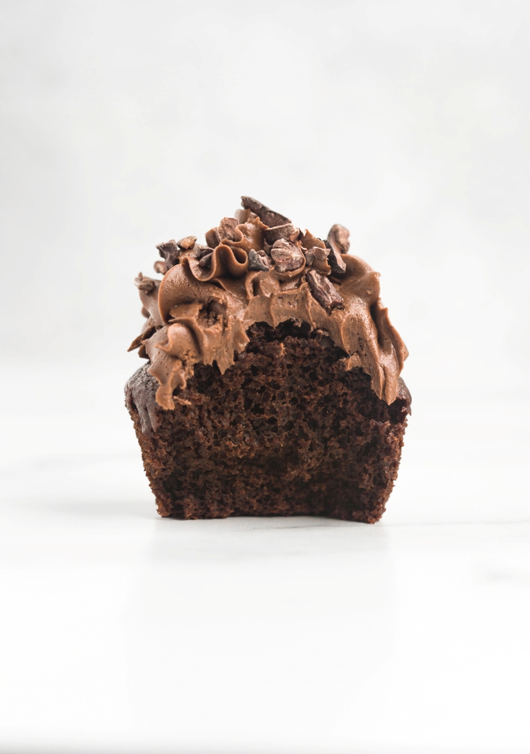 inside view of cupcake with chocolate frosting
