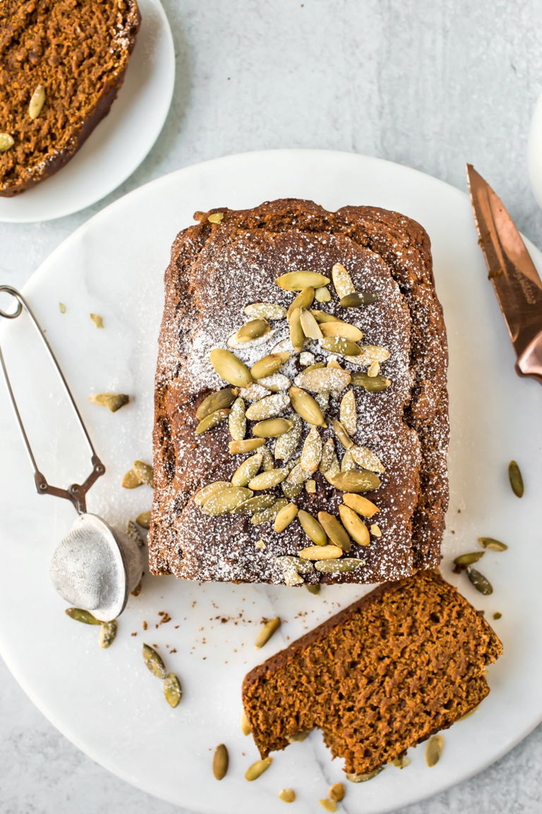 overhead shot of vegan pumpkin bread with seeds and sugar