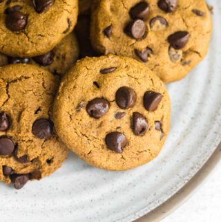 closeup of plate of vegan pumpkin chocolate chip cookies