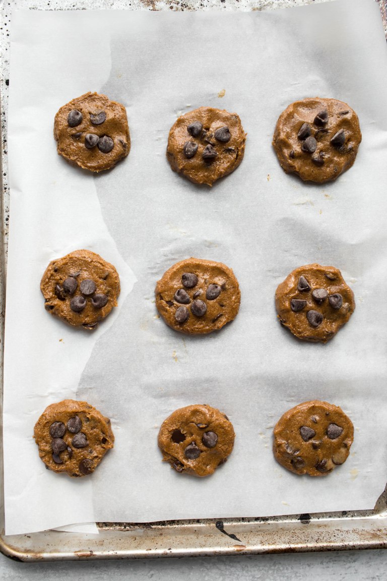 pre-baked pumpkin cookies on pan