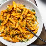sun-dried tomato penne pasta in white bowl