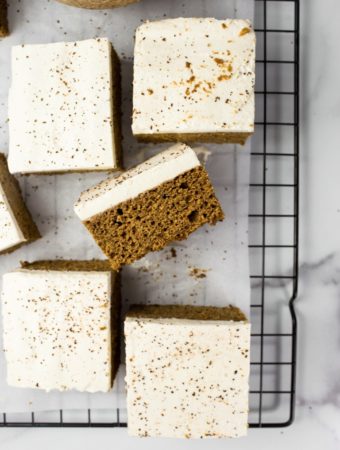 several slices of vegan pumpkin cake with frosting