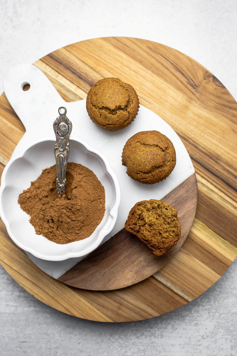 pumpkin muffins next to bowl of pumpkin spices