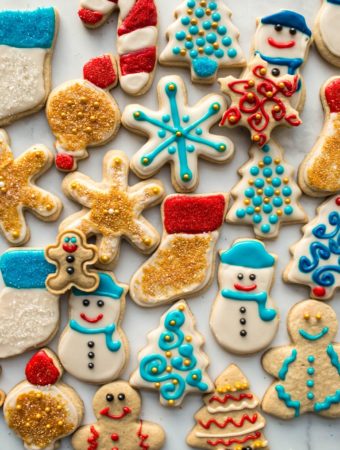 gluten free vegan sugar cookies decorated with icing on white board