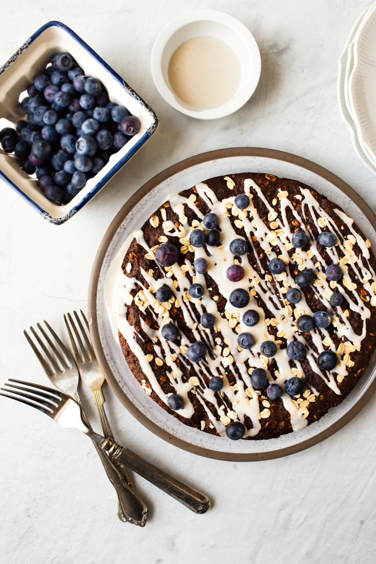 shot of top of cake with glaze and blueberries