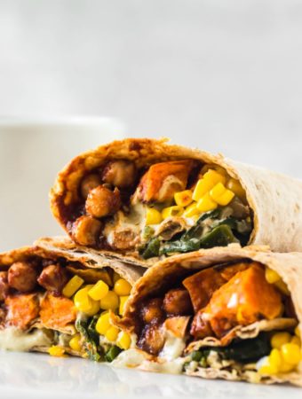 chickpea burritos stacked on top of each other on white plate