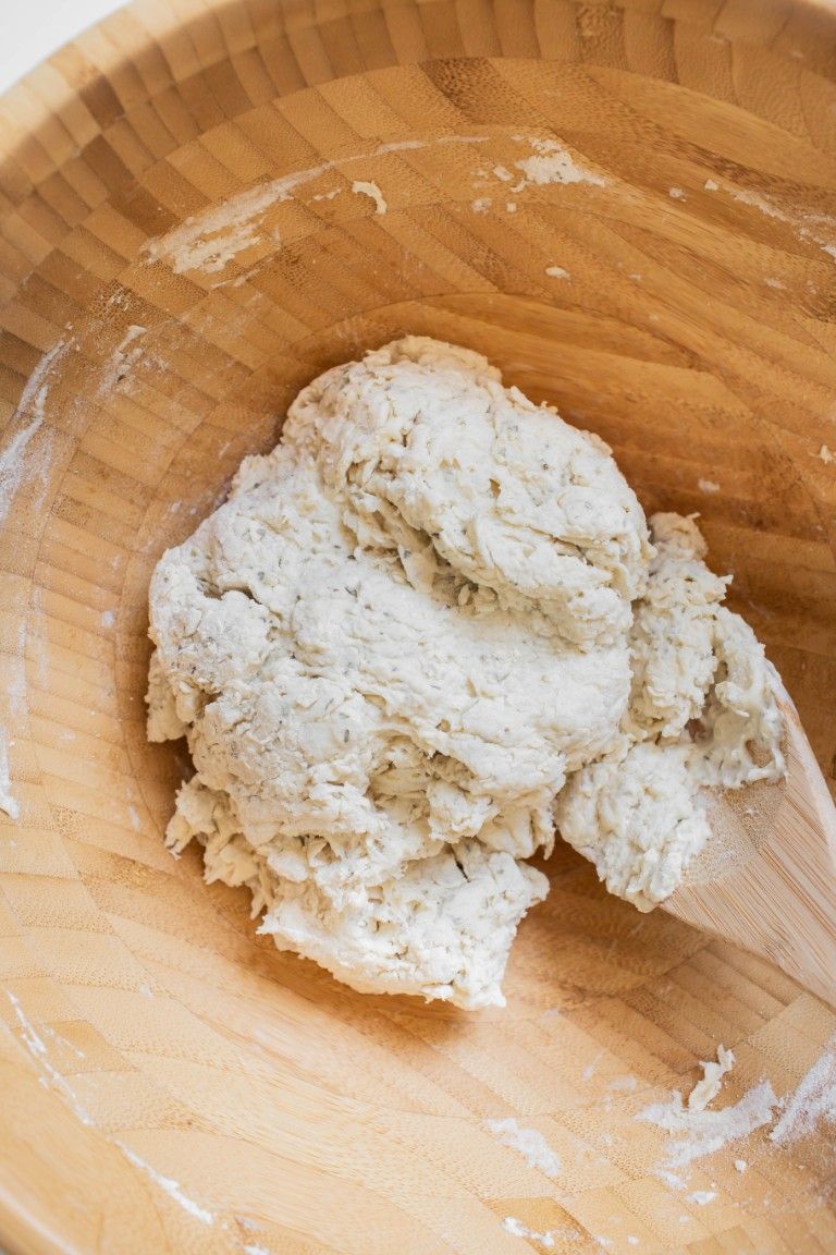 ball of dough in wood bowl