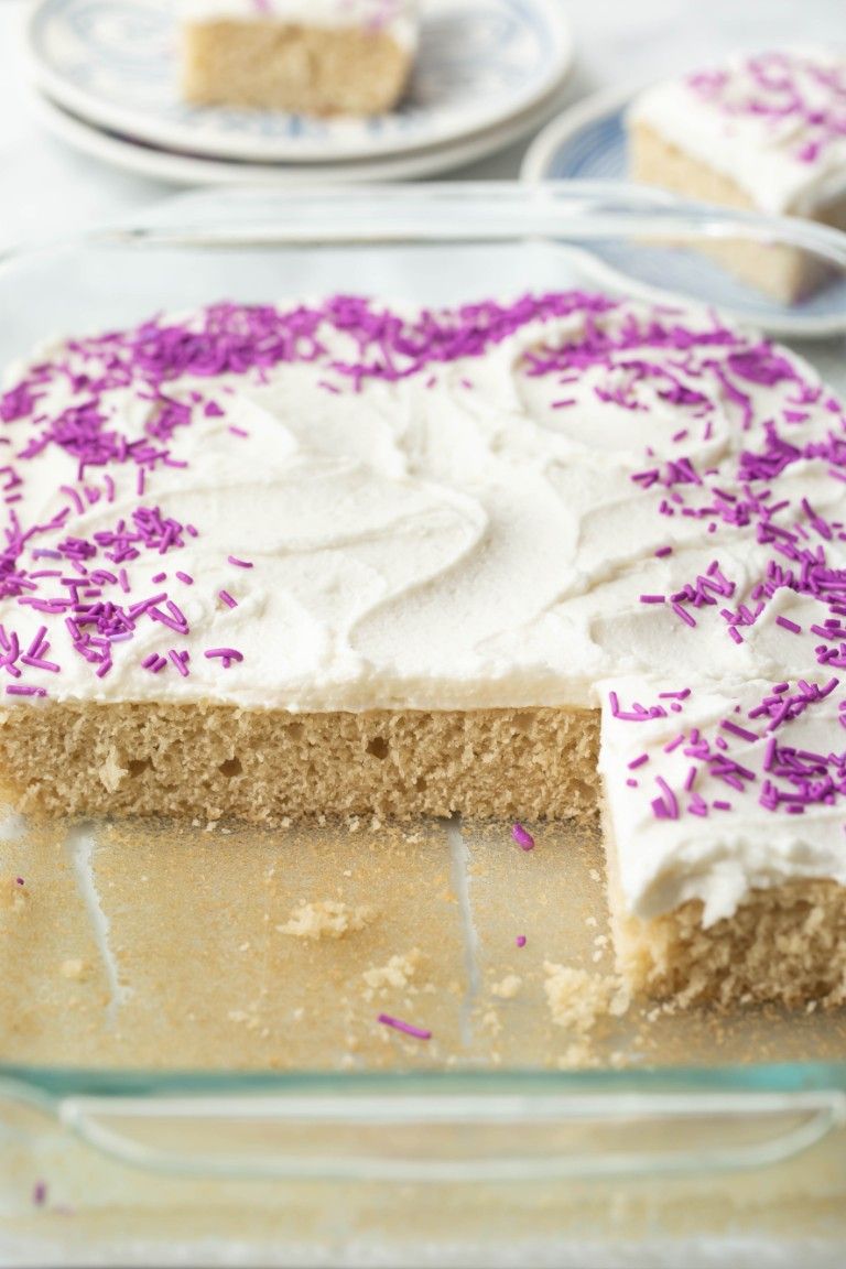 glass pyrex dish of cake with slices missing